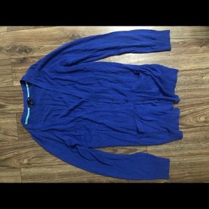 A blue cardigan with buttons.